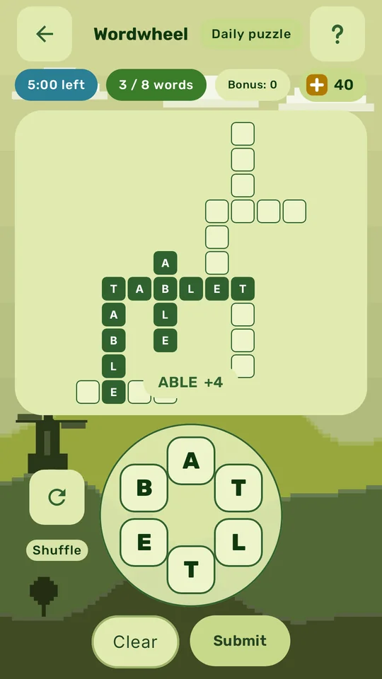 Wordwheel's daily puzzle, with three words found in the grid and the letter wheel below